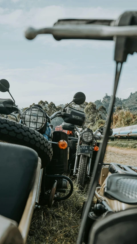 a group of motorcycles parked next to each other, by Lee Loughridge, trending on unsplash, sri lankan mad max style, thumbnail, high quality photo, pov photo