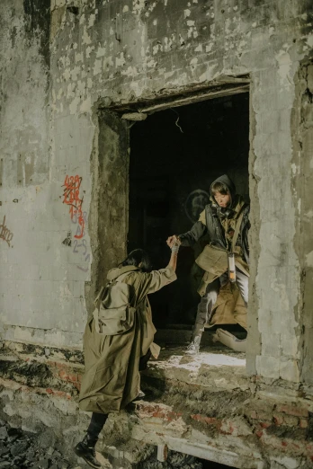 a couple of men standing in a doorway of a building, pexels contest winner, conceptual art, wearing russian ww 1 clothes, action shot girl in parka, begging, ( ( theatrical ) )