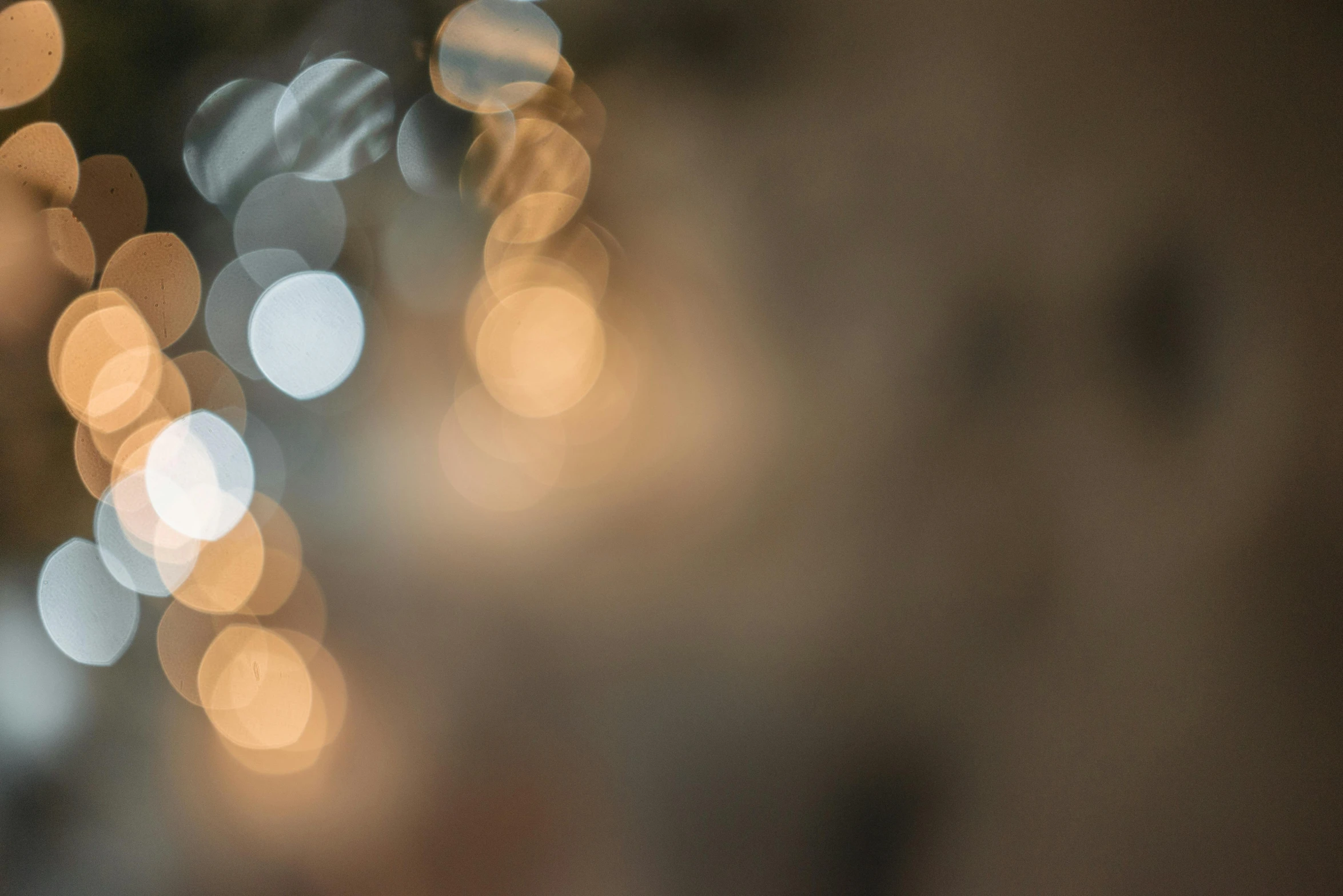 a blurry photo of a bunch of lights, a picture, inspired by Elsa Bleda, unsplash, light and space, overcast bokeh - c 5, bubbly, brown atmospheric lighting, silver light