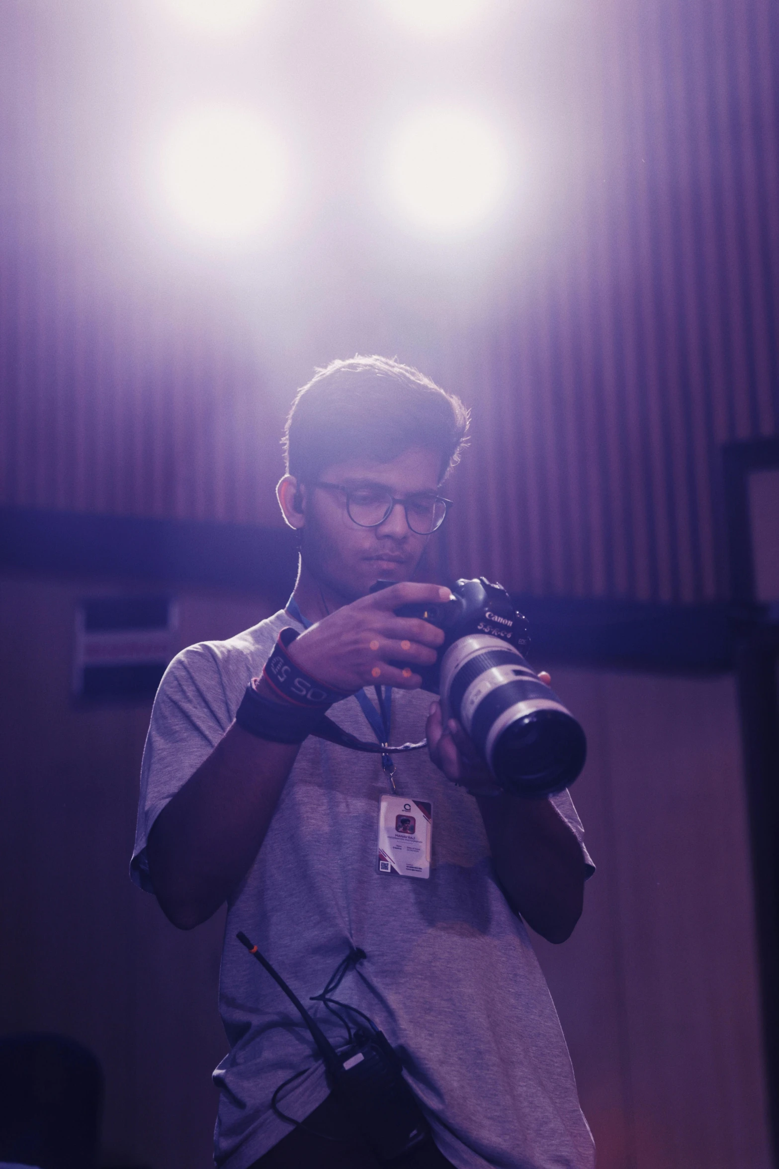 a man standing in a room holding a camera, by Max Dauthendey, jayison devadas, lights, cute photo, low colour