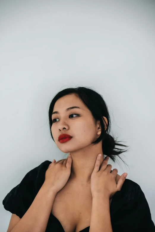 a woman in a black dress posing for a picture, an album cover, inspired by Ruth Jên, trending on pexels, double chin, asian girl, both have red lips, assamese aesthetic