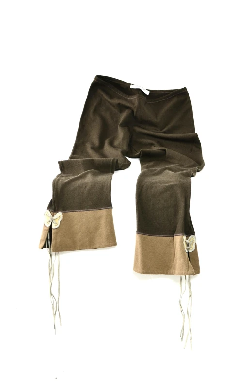 a pair of brown pants on a white background, by Nina Hamnett, renaissance, wide ribbons, 2000s, olive, upcycled