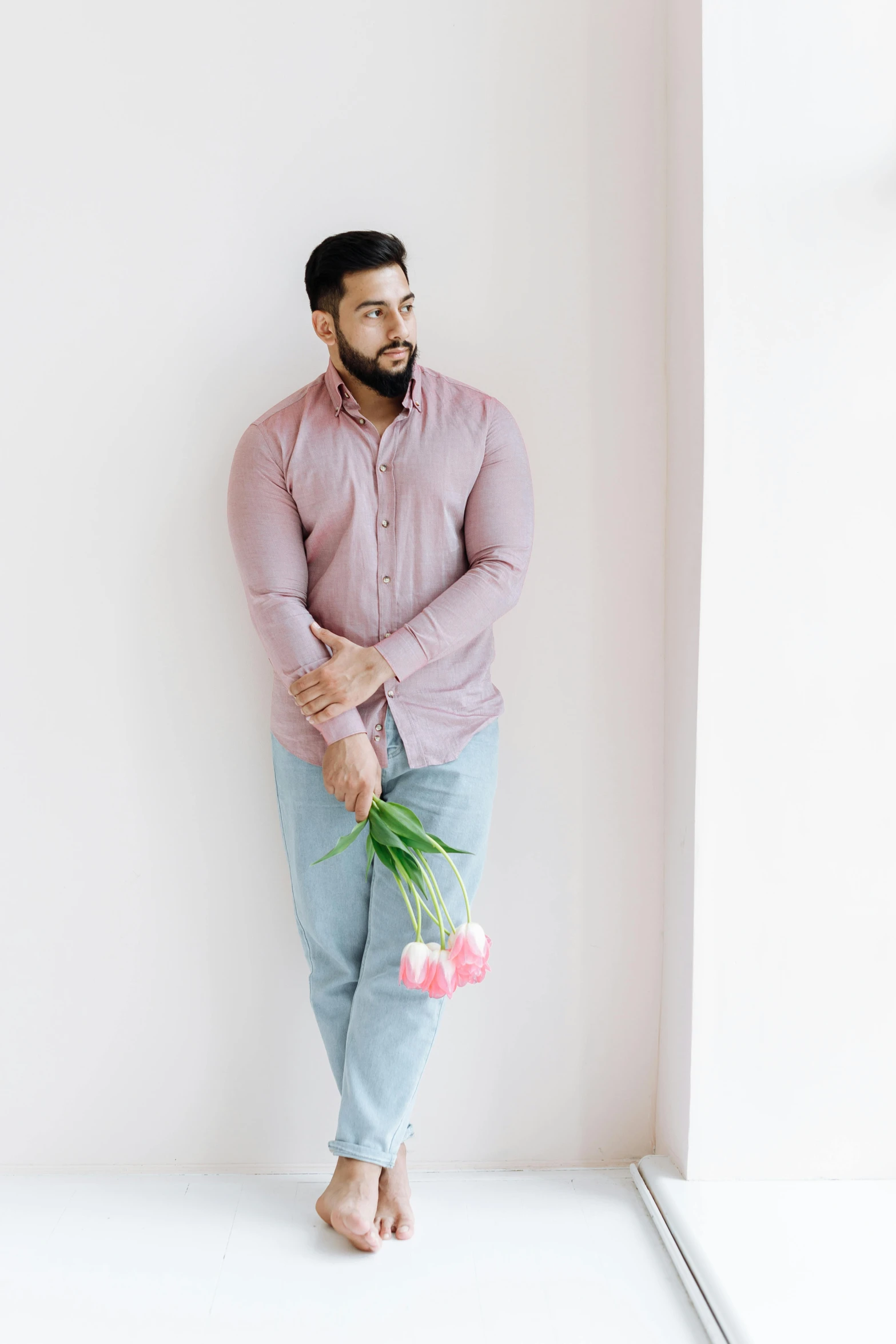 a man leaning against a wall holding a bouquet of flowers, trending on instagram, pink shirt, fullbody photo, february), profile image