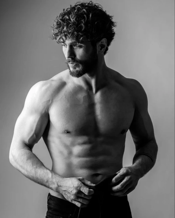 a black and white photo of a shirtless man, inspired by Diego Gisbert Llorens, curls on top, physical : tinyest midriff ever, liam, zachary corzine