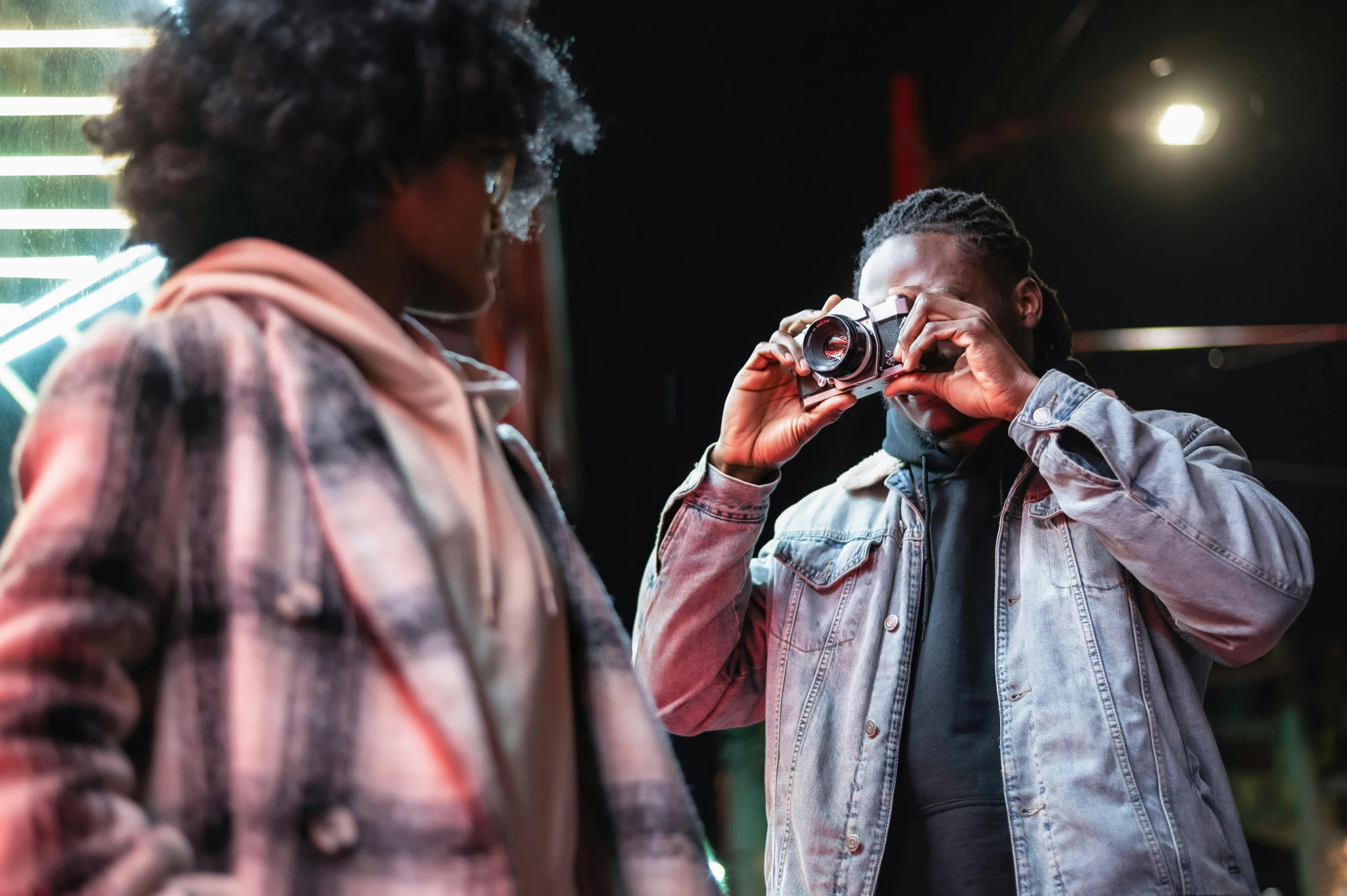 a man taking a picture of a woman with a camera, pexels contest winner, visual art, playboi carti and lil uzi vert, [ theatrical ], flash photography at night, headshot photoshoot