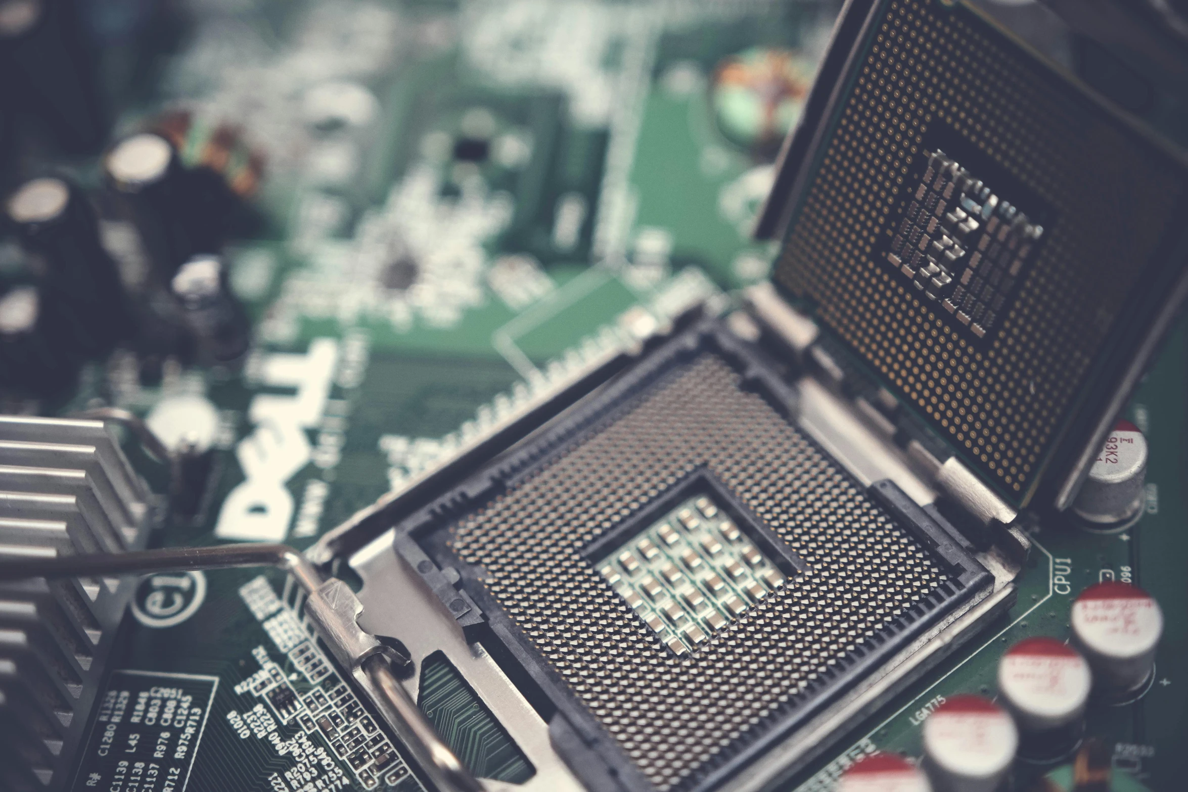 a close up of a computer chip on a motherboard, a computer rendering, unsplash, a green, historical, where a large, it specialist