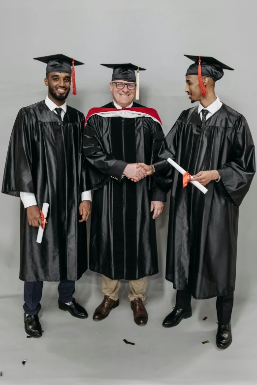 a group of three men standing next to each other, academic art, graduation photo, black and red only, 2019 trending photo, full body photgraph