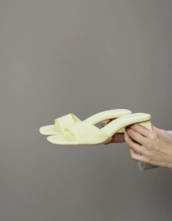 a close up of a person holding a banana, wearing open toe heels, product view, けもの, soft white rubber