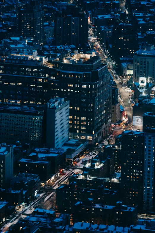 an aerial view of a city at night, by Daniel Seghers, unsplash contest winner, new york streets, square, high quality photo, looking left