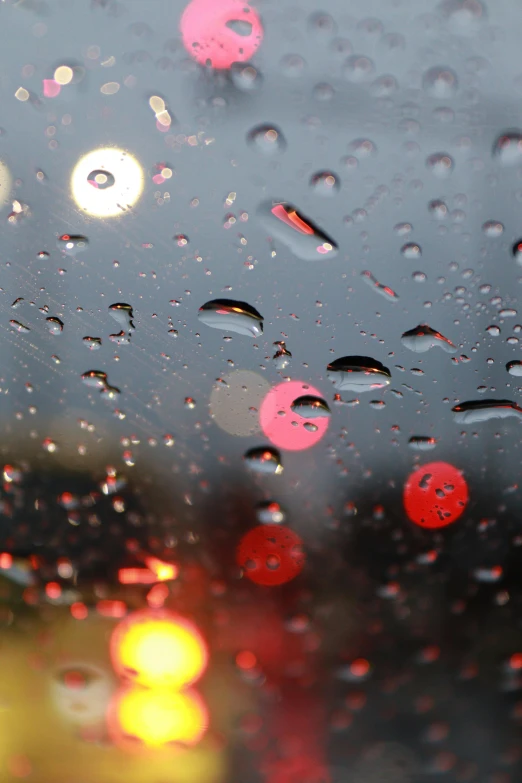 rain drops on the windshield of a car, by David Donaldson, flickr, promo image, red lights, rain sensor, 2 0 % pearlescent detailing