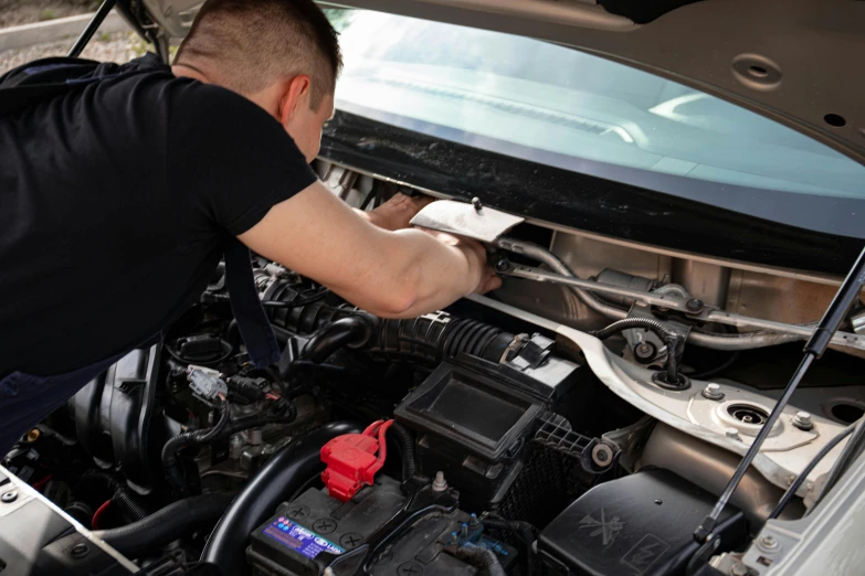 a man working on a car engine, a picture, shutterstock, 15081959 21121991 01012000 4k, lachlan bailey, fine detailing, profile image