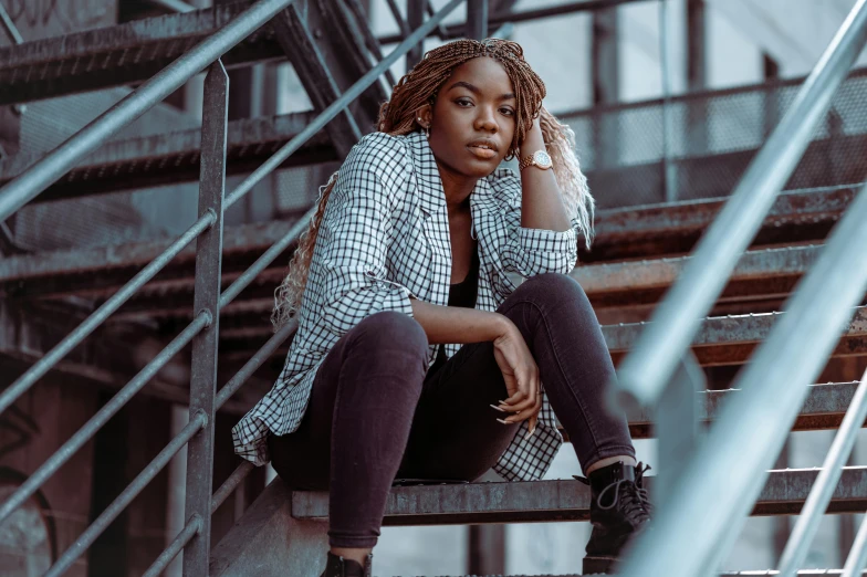 a woman sitting on a set of stairs, trending on pexels, black teenage girl, complex background, modelling, sittin