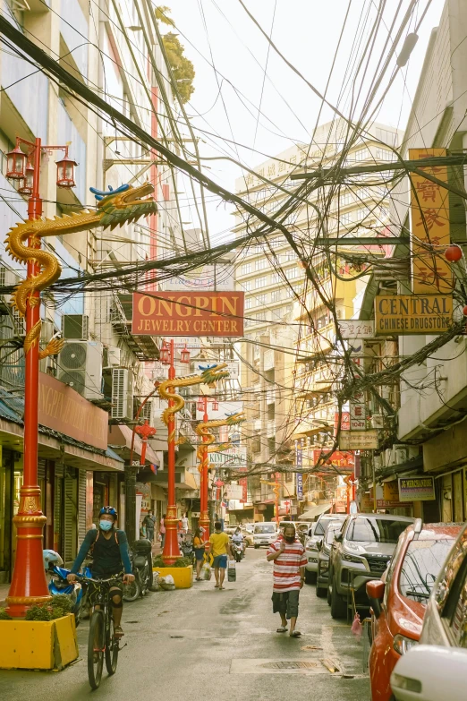 a street filled with lots of traffic next to tall buildings, maximalism, tangled overhead wires, asia, old town, broken neon signs