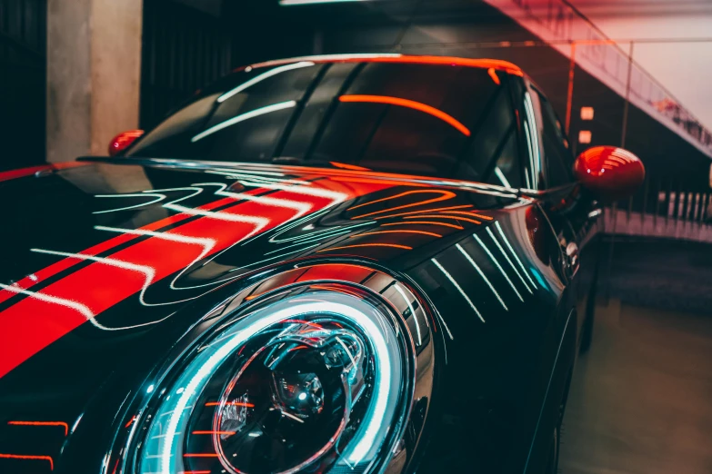 a red and black sports car parked in a garage, pexels contest winner, neon reflections, mini cooper, thumbnail, detailed light