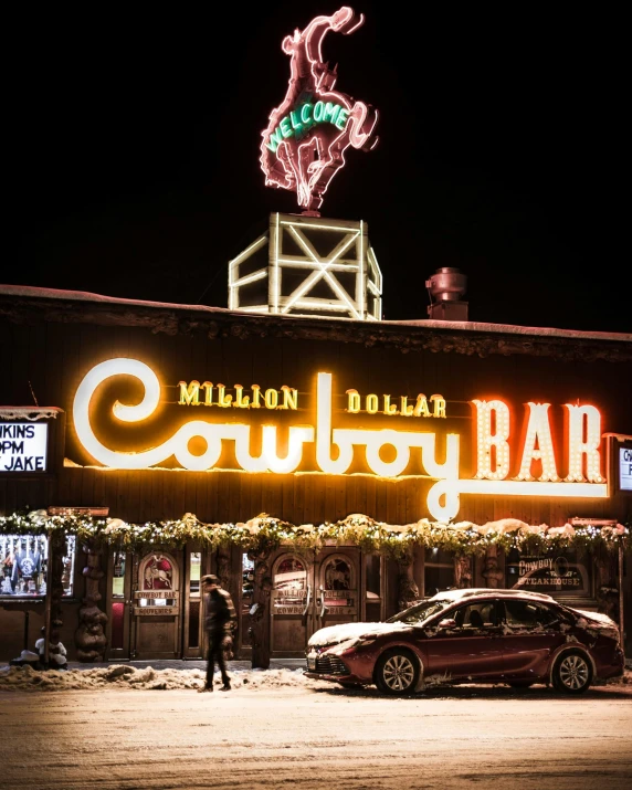 a car parked in front of a bar at night, cowboy on the range, gummy bear, winter setting, profile image