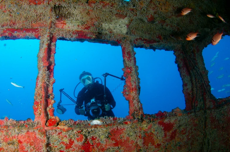 a person in a scuba suit looking out of a window, a photo, happening, shipwreck, avatar image, camera photo, rectangle
