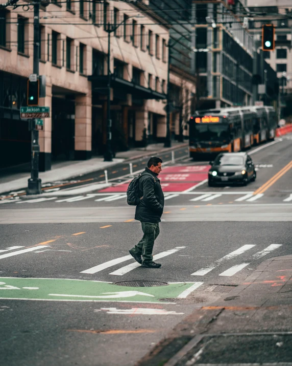 a man crossing a street in the middle of a city, seattle, instagram post, lgbtq, schools