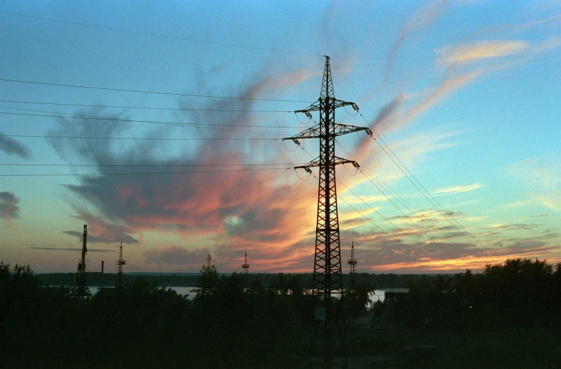 a power line with a sunset in the background, an album cover, by Attila Meszlenyi, romanticism, color ektachrome photograph, electricity archs, water and power, lut