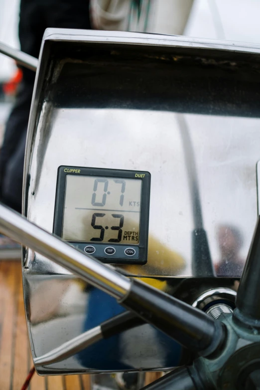 a close up of a clock on a motorcycle, godlike temperature, square, sup, grey