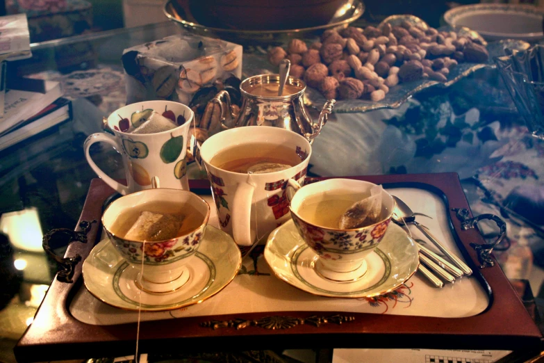 a tray that has some cups and saucers on it, a portrait, by Pamela Ascherson, pexels, dau-al-set, square, nightcap, dessert, tea