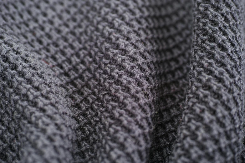 a close up of a gray knitted blanket, by Adam Marczyński, unsplash, cloth and metal, anthracite, high quality material bssrdf, smart textiles