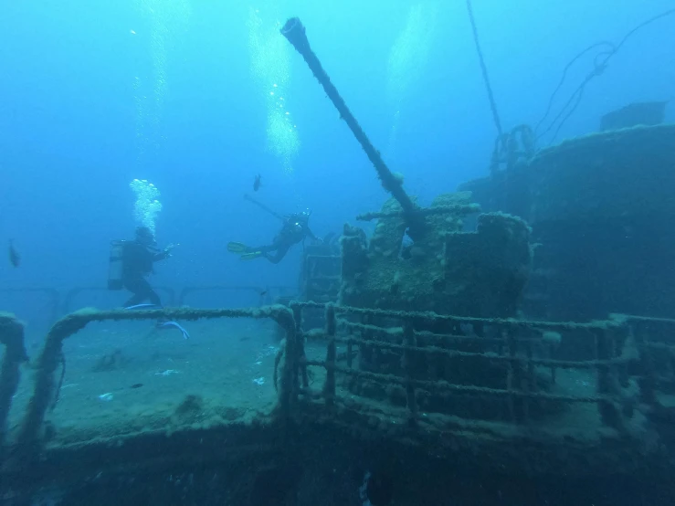 a couple of people that are in the water, by Daniel Lieske, hurufiyya, titanic tank with legs, old scuba, thumbnail, blue