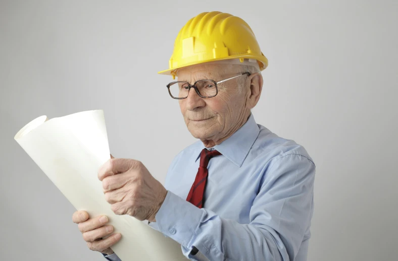 a man in a hard hat holding a piece of paper, grandfatherly, uploaded, engineering, 15081959 21121991 01012000 4k