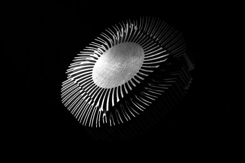 a black and white photo of a fan in the dark, polycount, computer art, cpu gpu wafer, made out of shiny white metal, instagram post, radiating power