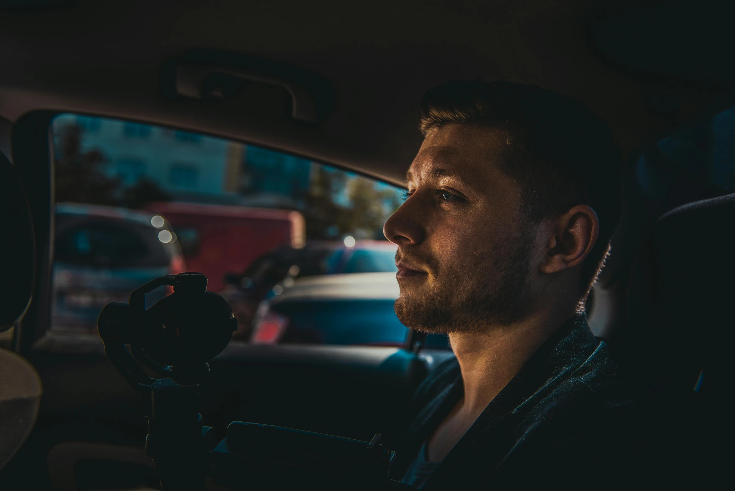 a man sitting in the back seat of a car, by Adam Marczyński, pexels contest winner, graded with davinci resolve, calm night. over shoulder shot, avatar image, profile picture 1024px