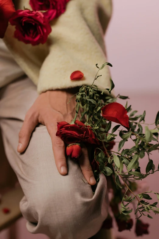 a close up of a person holding a bunch of flowers, an album cover, by Elsa Bleda, romanticism, thorns, lovers, impeccably dressed, ignant