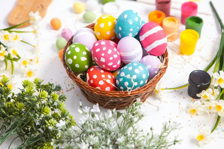 a basket filled with lots of colorful easter eggs, unsplash, process art, polka dot tables, painted with colour on white, flower decorations, listing image