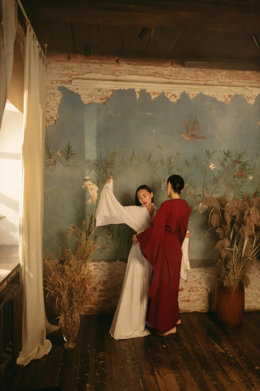 a couple of people that are standing in a room, a picture, inspired by Shin Saimdang, neo-romanticism, ao dai, rustic, rome, holiday