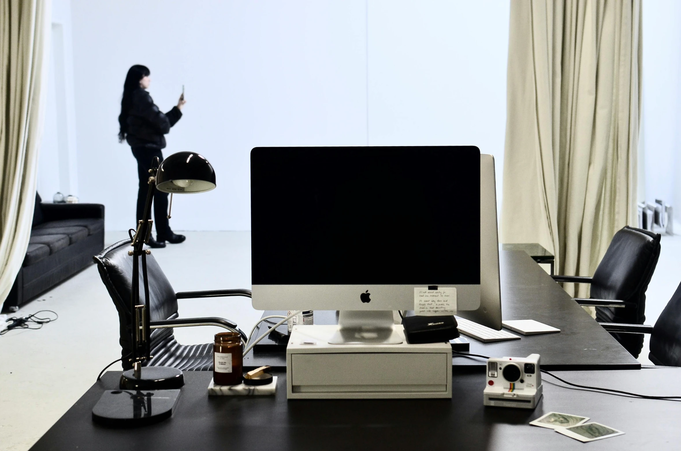 a computer monitor sitting on top of a desk, inspired by Marina Abramović, hyperrealism, photographed for reuters, hasselblad photography, zezhou chen, **cinematic