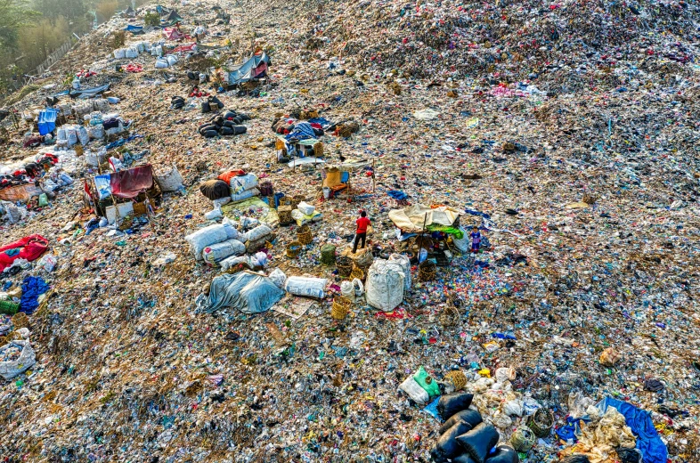 a pile of garbage on the side of a road, by Daniel Lieske, pexels, plasticien, aerial view of an ancient land, 🤬 🤮 💕 🎀, jia ruan, people on the ground