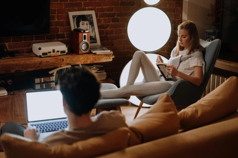 a man and a woman sitting on a couch in front of a laptop, trending on pexels, lounge room, teenager hangout spot, charlie bowater and artgeem, comfy chairs