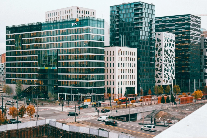 a city filled with lots of tall buildings, by Tom Wänerstrand, pexels contest winner, modernism, espoo, elaborate details, office building, photograph of the city street