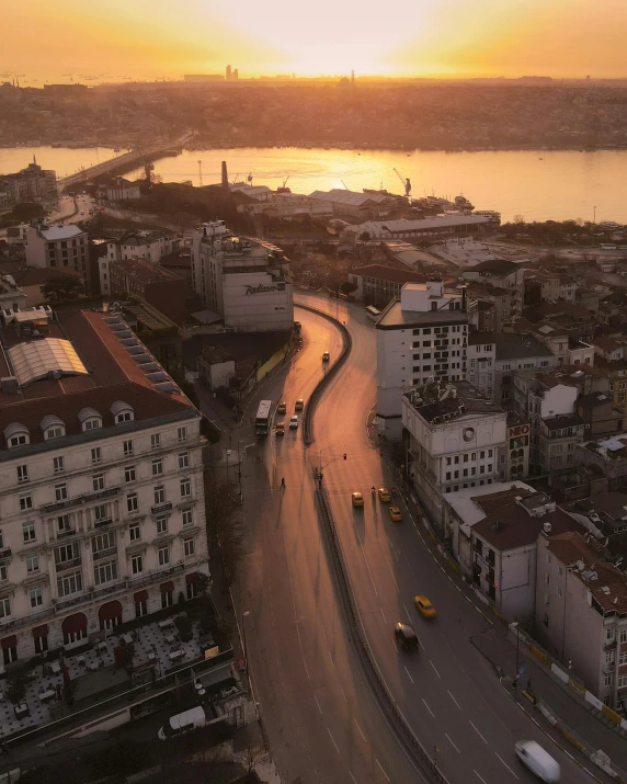 an aerial view of a city at sunset, by irakli nadar, pexels contest winner, lgbtq, fallout style istanbul, city street, slide show