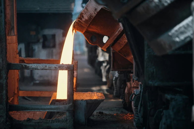 a close up of a piece of metal being poured, a picture, unsplash contest winner, factory background, australian, cast, 15081959 21121991 01012000 4k