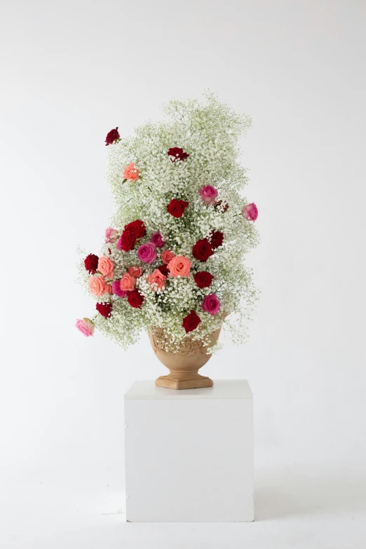 a vase that has some flowers in it, on a pedestal, ethereal soft and fuzzy glow, vibrant palette, overflowing