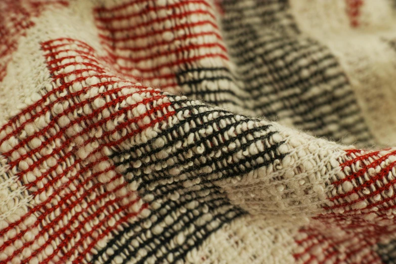 a close up of a red, white and black blanket, by Anni Albers, unsplash, sōsaku hanga, beige, medium detail, chiffon, distressed