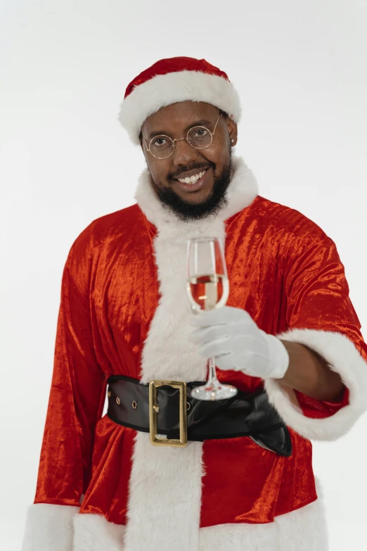 a man in a santa suit holding a glass of wine, an album cover, pexels, renaissance, black man, gif, sam hyde, ( ( theatrical ) )