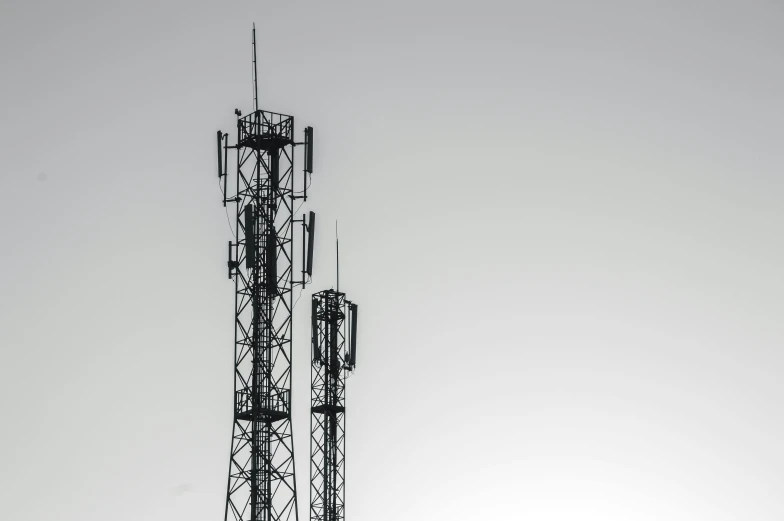 a black and white photo of two cell towers, pexels, postminimalism, brown, square, high quality upload, phone photo