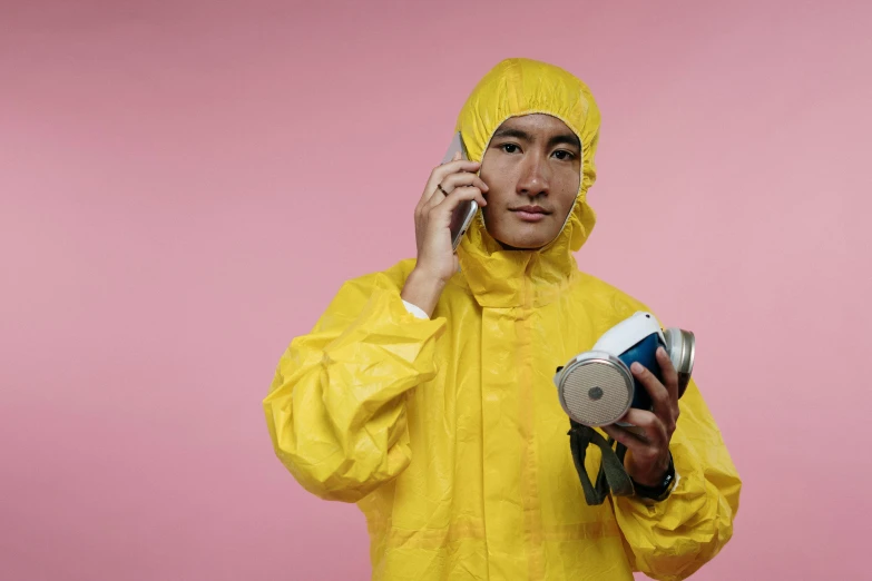 a man in a yellow rain suit talking on a cell phone, pexels, hyperrealism, wearing lab coat and a blouse, avatar image, asian man, crime scene photo