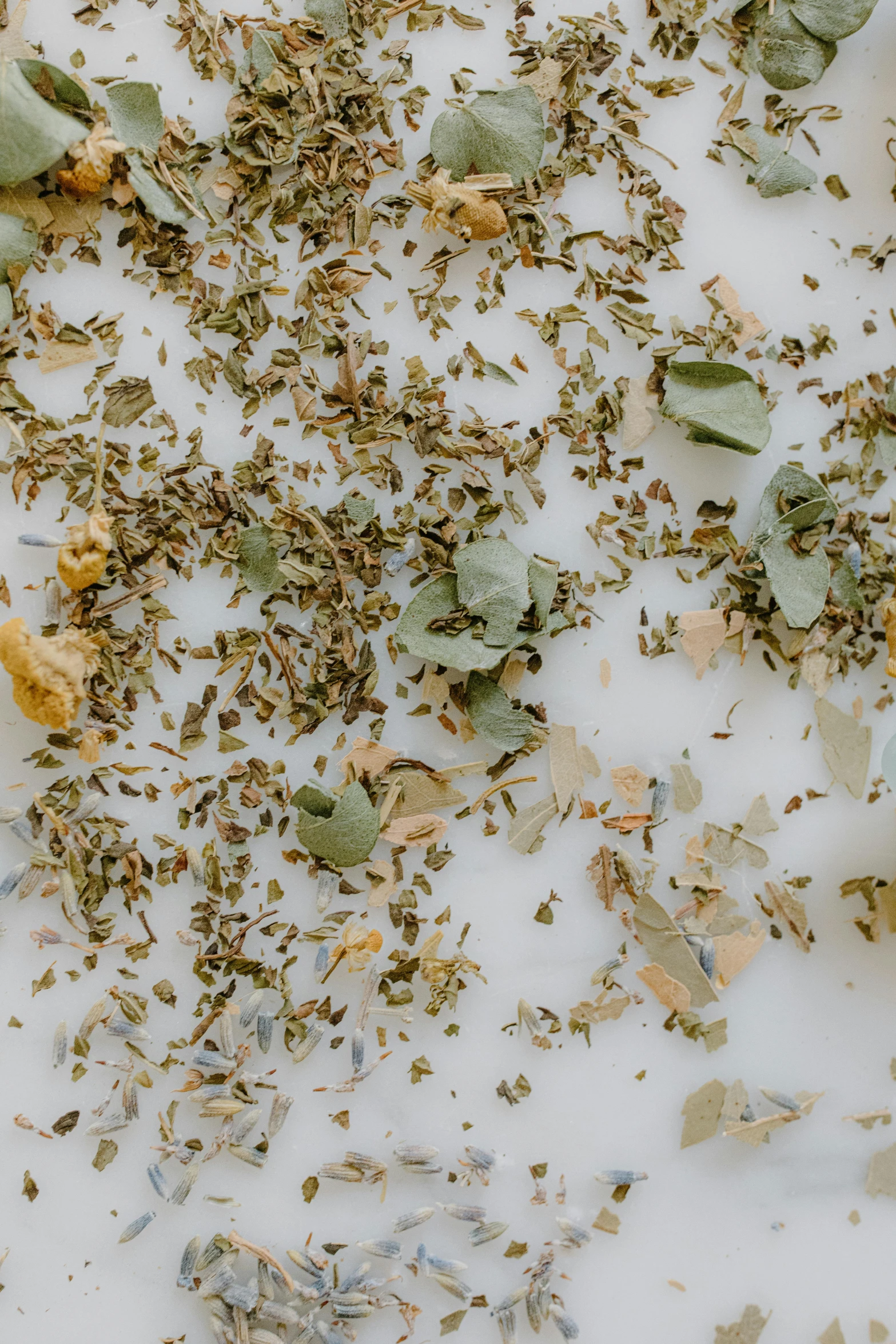 a pile of dried herbs sitting on top of a table, by Jessie Algie, trending on pexels, perky woman made of petals, milk - bath effect, close-up product photo, detail shot