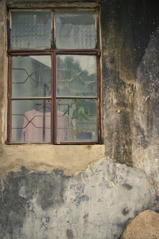 a window that is on the side of a building, an album cover, inspired by Zhang Kechun, flickr, rustic and weathered, glass window, old color photograph, foreboding room