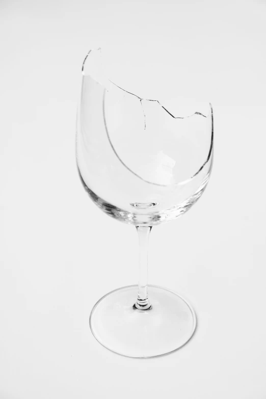 a broken wine glass sitting on top of a table, by Jan Rustem, set against a white background, cuts, sydney hanson, 2022