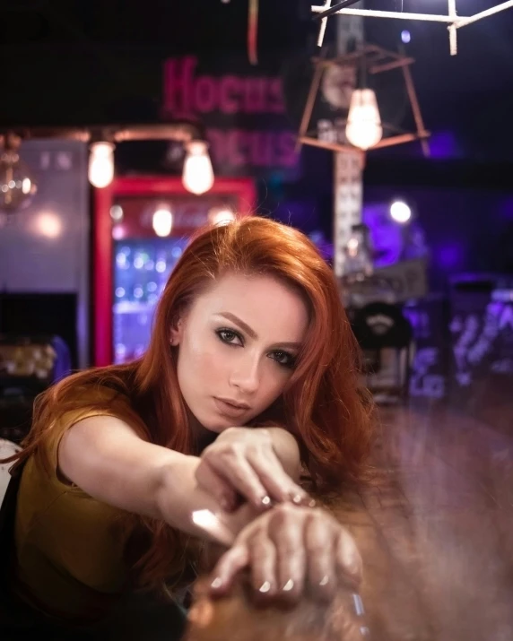 a woman reaching for a drink at a bar, a portrait, trending on deviantart, red hair and attractive features, doja cat, looking defiantly at the camera, promo image