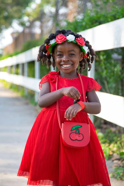 a little girl in a red dress holding a red purse, inspired by Kate Greenaway, shutterstock contest winner, dark skinned, 🎀 🧟 🍓 🧚, cherry explosion, costumes