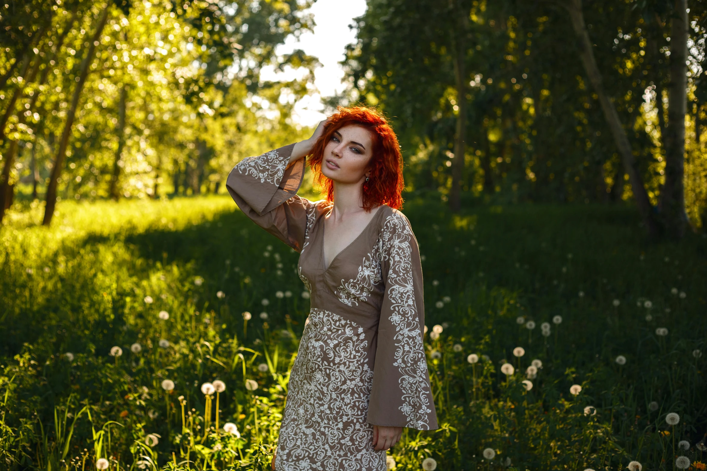 a woman with red hair standing in a field of dandelions, inspired by Elsa Bleda, pexels contest winner, renaissance, wearing silver silk robe, eleanor tomlinson, patterned clothing, portrait image