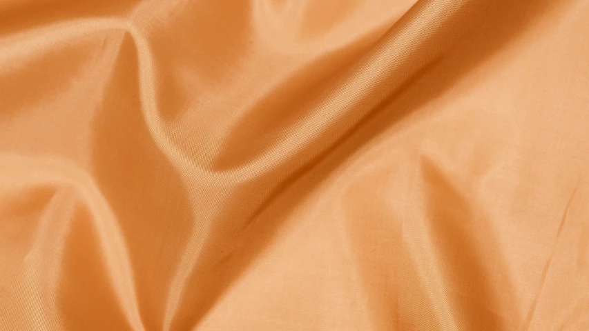 a close up of a plain orange fabric, inspired by Christo, baroque, rose gold, (light orange mist), satin, night setting